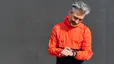 man in orange running jacket