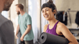 Woman and man talking in a fitness studio