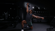 Dre Mayes demonstrates a kettlebell exercise  