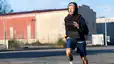 Man running in a weighted vest