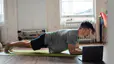 Man demonstrates how to engage your core while doing a plank
