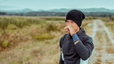 A man experiencing a runny nose when exercising outside.