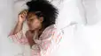 Young woman in bed
