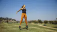 Woman jumping while exercising at outdoor park