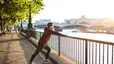 Man does a calf stretch outdoors after a run