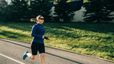 Woman practicing how to stop overstriding while runing outside.