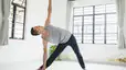 Man doing Triangle Pose (Trikonasana)