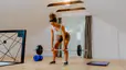 Woman does a deadlift exercise at home