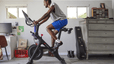 Man riding Peloton on Bike