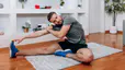 Man stretches at home