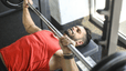 Man does a bench press exercise 