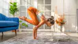 Woman practices yoga at home