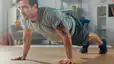 Man doing a push-up inside