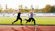Three women running on a track