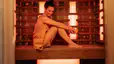 A woman relaxing in an infrared sauna and enjoying the benefits of an infrared sauna.