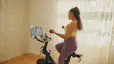 Woman on Peloton Bike
