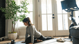 Woman doing yoga inside