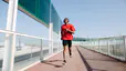 Man does a Fartlek run while running outside