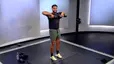 Peloton instructor Rad Lopez demonstrating a dumbbell upright row with proper form
