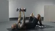 Adrian Williams demonstrates a skull crusher exercise 