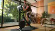 man riding Peloton bike