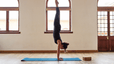 Woman does a handstand, how to do a handstand