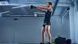 Man doing a kettlebell swing inside