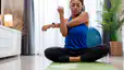 Woman doing a cross-body shoulder stretch