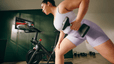 Woman does a strength training Peloton class