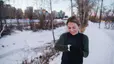 Woman checks her watch on a cold-weather run