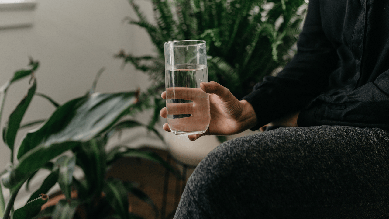 How Drinking Water Before Bed Affects Sleep | The Output by Peloton