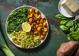 A plate with sweet potatoes, spinach, and scrambled tofu. Sweet potatoes and spinach are two of the best antioxidant foods.