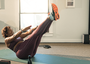 woman doing yoga at home