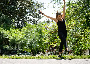 woman enjoying sunshine after workout