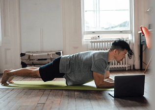 Man demonstrates how to engage your core while doing a plank