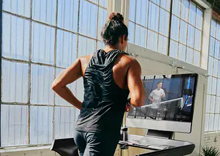 Man using the Peloton App outside