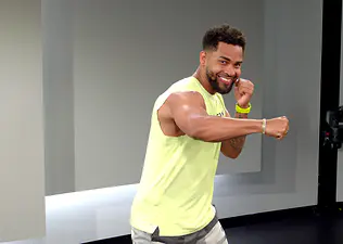 Rad Lopez demonstrates how to throw a hook in boxing Peloton class