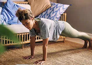 Woman does the inchworm exercise