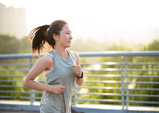 A woman going for a run in the morning outside.