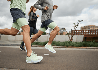 Several people running outdoors together