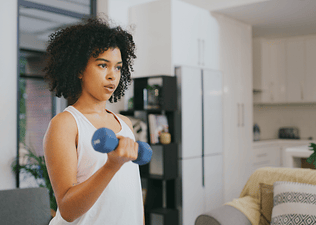 Woman exercises at home 