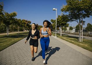 Two friends run outdoors together, a form of aerobic exercise