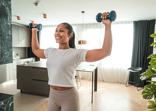 Woman doing beginner arm workouts at home