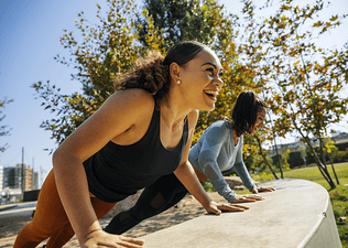 Two woman exercise outdoors