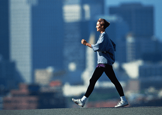 Woman walking outdoors in a city
