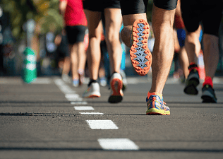 Shot of man running race with bottom of sneaker showing — Getty Images (Pavel1964)