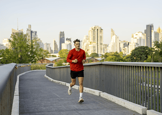 Man running outdoors, an example of a Zone 3 cardio workout