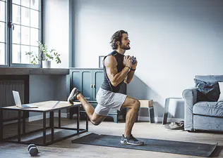 Man does exercise warm up at home