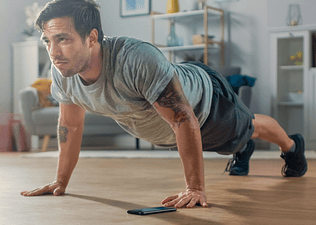 Man doing a push-up inside