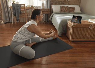 woman stretching after getting out of bed
